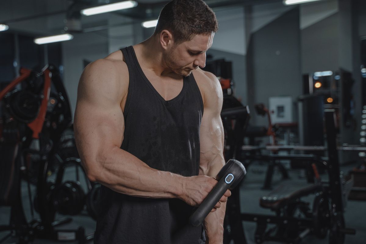 BPC-157 TB-500 Blend — Tissue Repair and Recovery Research | Arma Peptides UK Athlete using muscle recovery tool — BPC-157 TB-500 Wolverine Stack peptide blend studied for tissue repair and recovery research