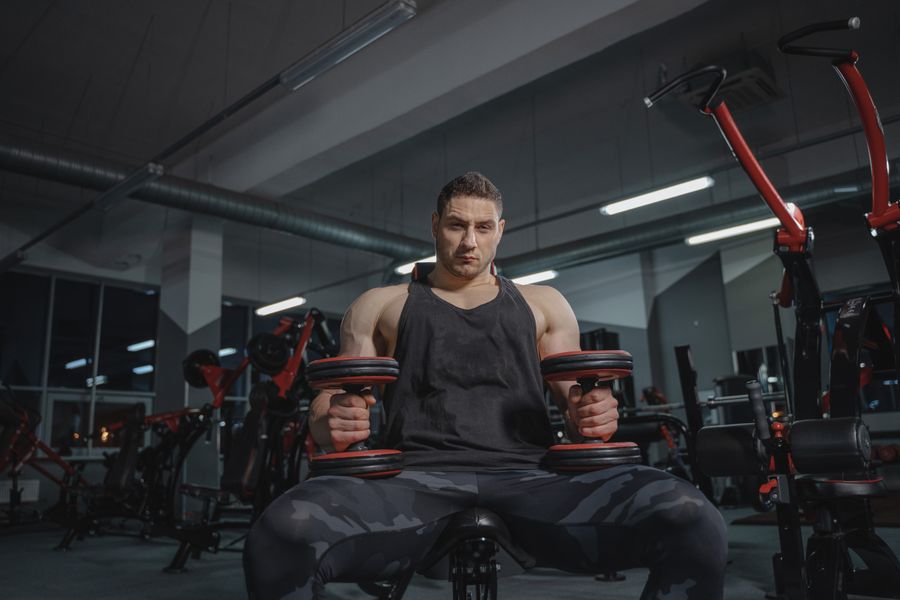 Happy personal training session for a middle-aged man indoors