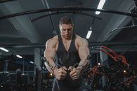 A Bodybuilder Working Out at the Gym