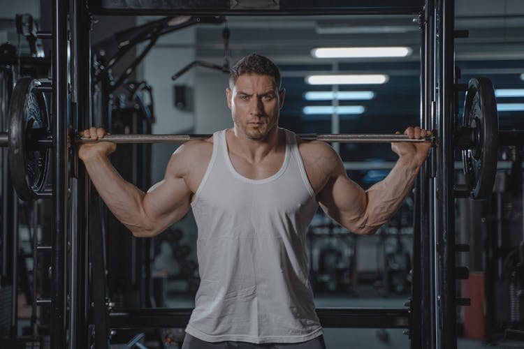 A Man Working Out At The Gym