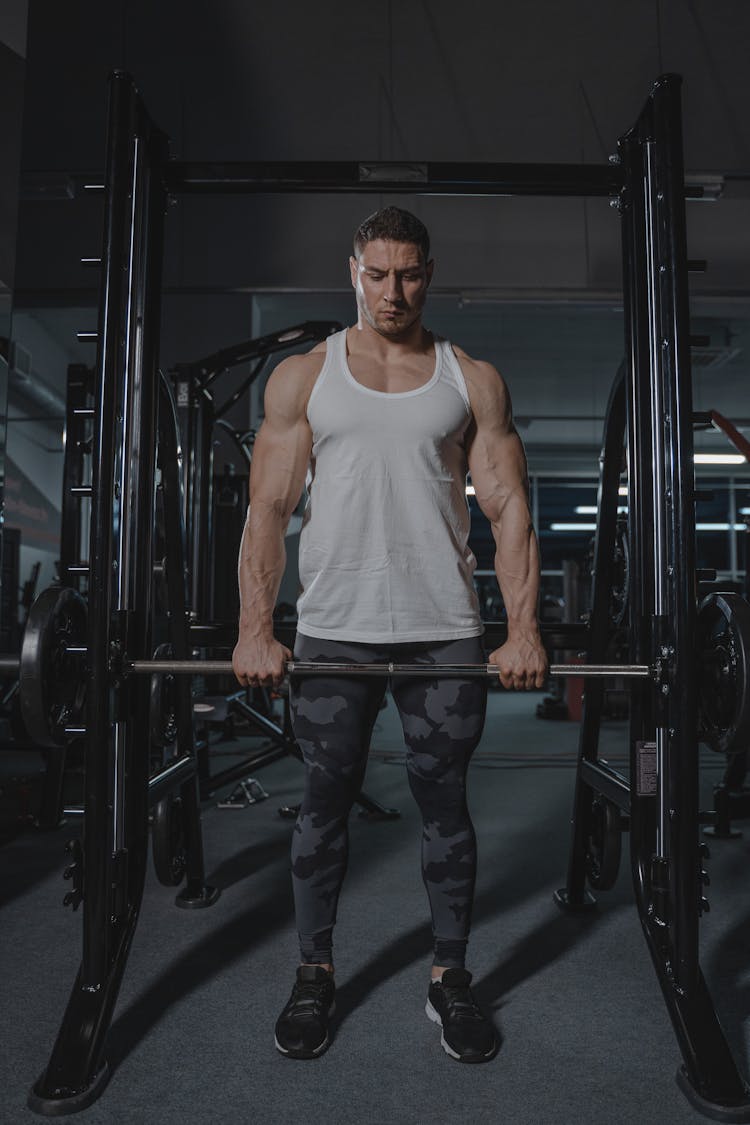 A Man Holding A Barbell