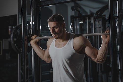 Free A Man Lifting a Barbell  Stock Photo