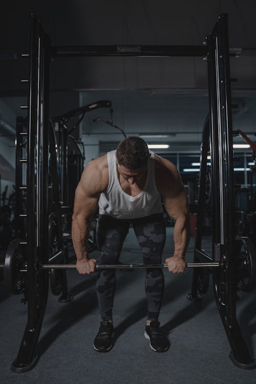 Free A Muscular Man Lifting a Barbell  Stock Photo