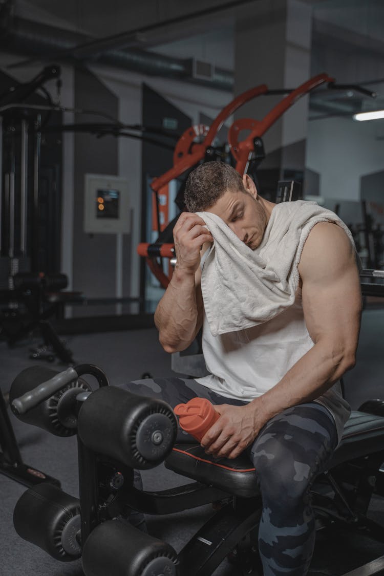 Man In White Tank Top At The Gym