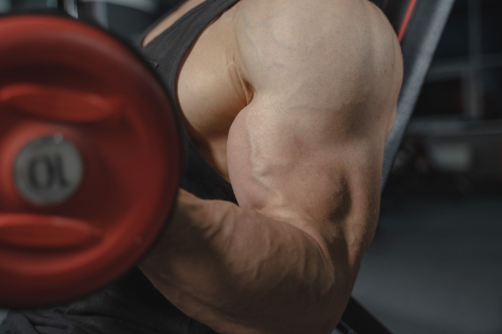 Person stretching an elbow and forearm in bright natural light