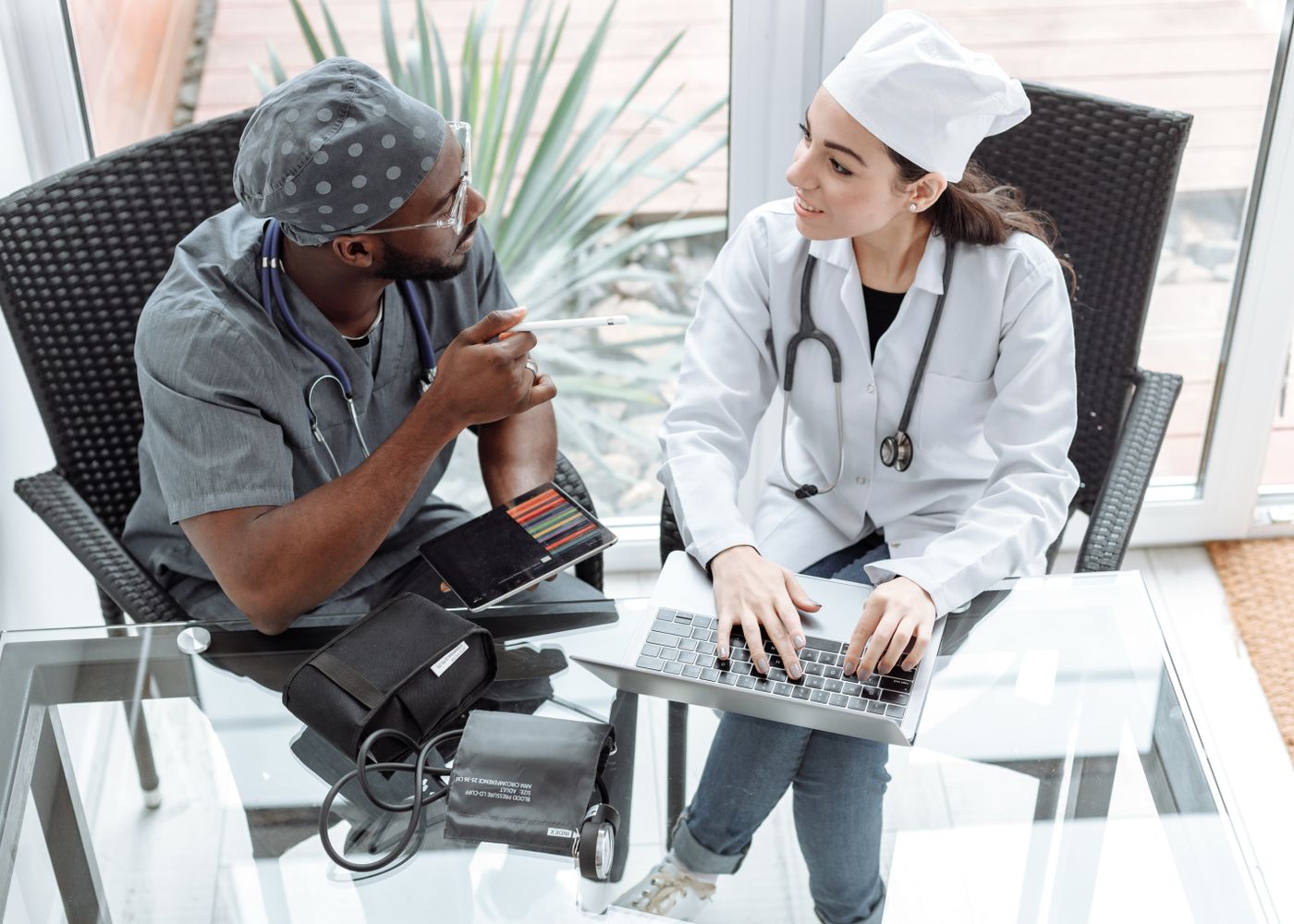 Two healthcare professionals coordinating on a patient referral