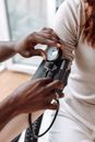 Woman in Gray Long Sleeve Shirt Holding Black Dslr Camera