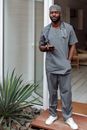A Man in Scrub Suit Taking a Break