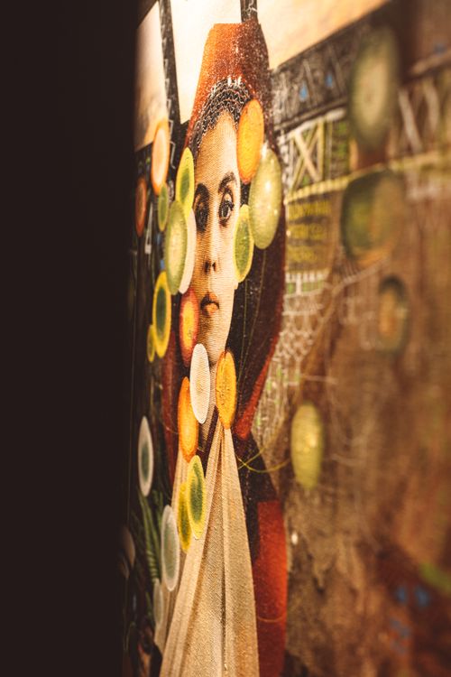 Free Side view of a vibrant and colorful abstract portrait hanging on a wall. Stock Photo