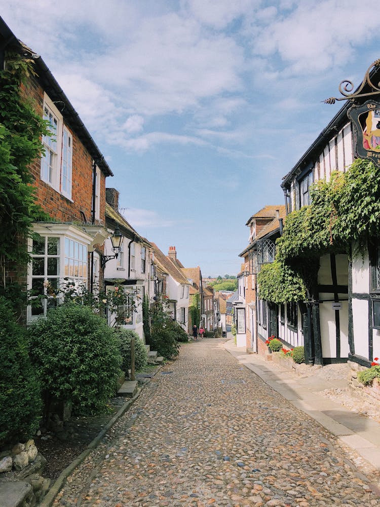 Narrow Cobblestone Street With Old English Houses