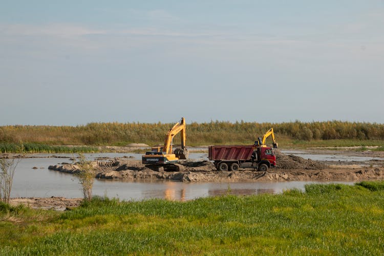 Diggers And Truck At Marsh