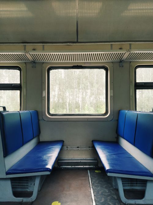 Free Interior view of an empty train carriage with blue seats in Novosibirsk, Russia. Stock Photo