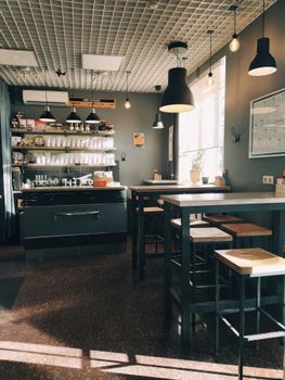 Warm and inviting café interior in Novosibirsk featuring contemporary design and cozy seating.