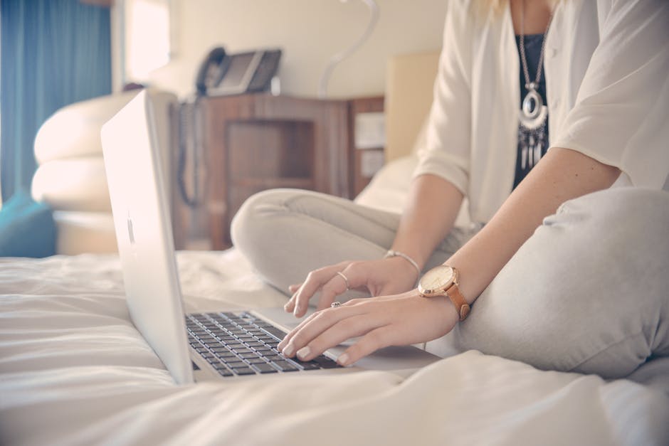 Woman Browsing the Web Using a Laptop