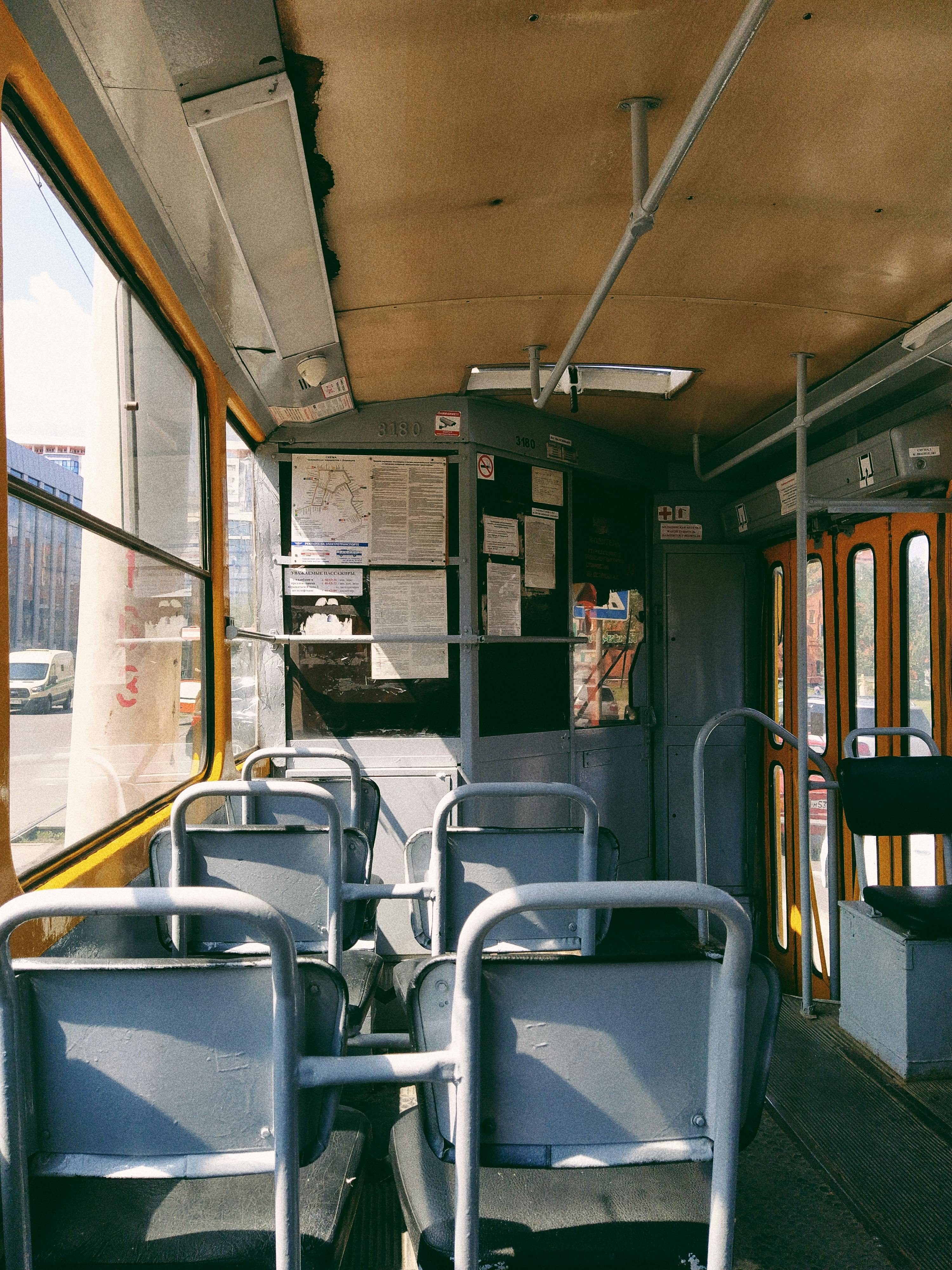Free Explore the classic interior of a Russian tram in Barnaul, showcasing its vintage charm and seating arrangement. Stock Photo