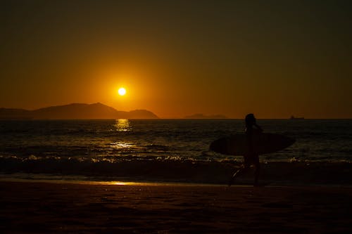 Darmowe zdjęcie z galerii z aktywność na plaży, atardecer, brzeg plaży