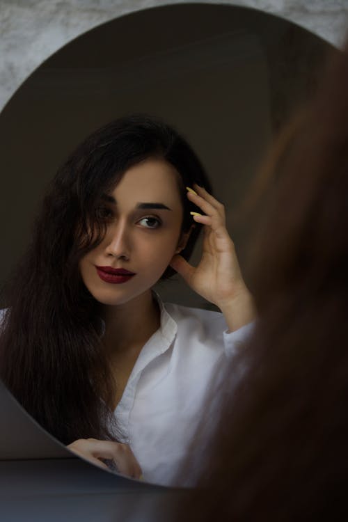 A Woman Looking at the Mirror