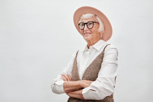 An Elderly Woman in Eyeglasses Smiling and Posing