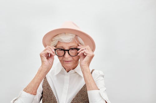 A Woman Wearing Eyeglasses and Hat