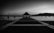 Person Walking Across Pier