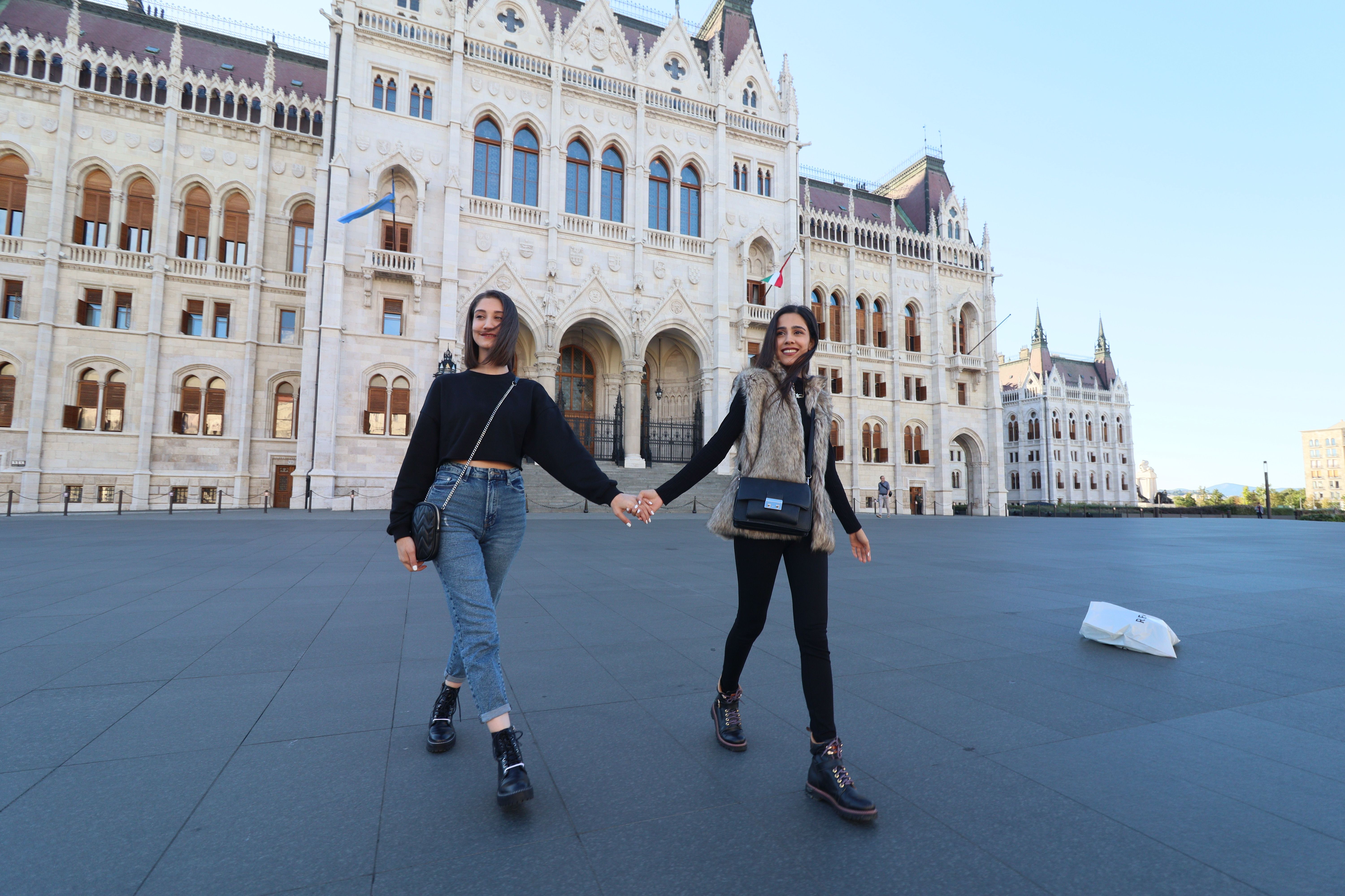 Woman wearing comfortable walking shoes on a cobblestone street in Budapest, Hungary
