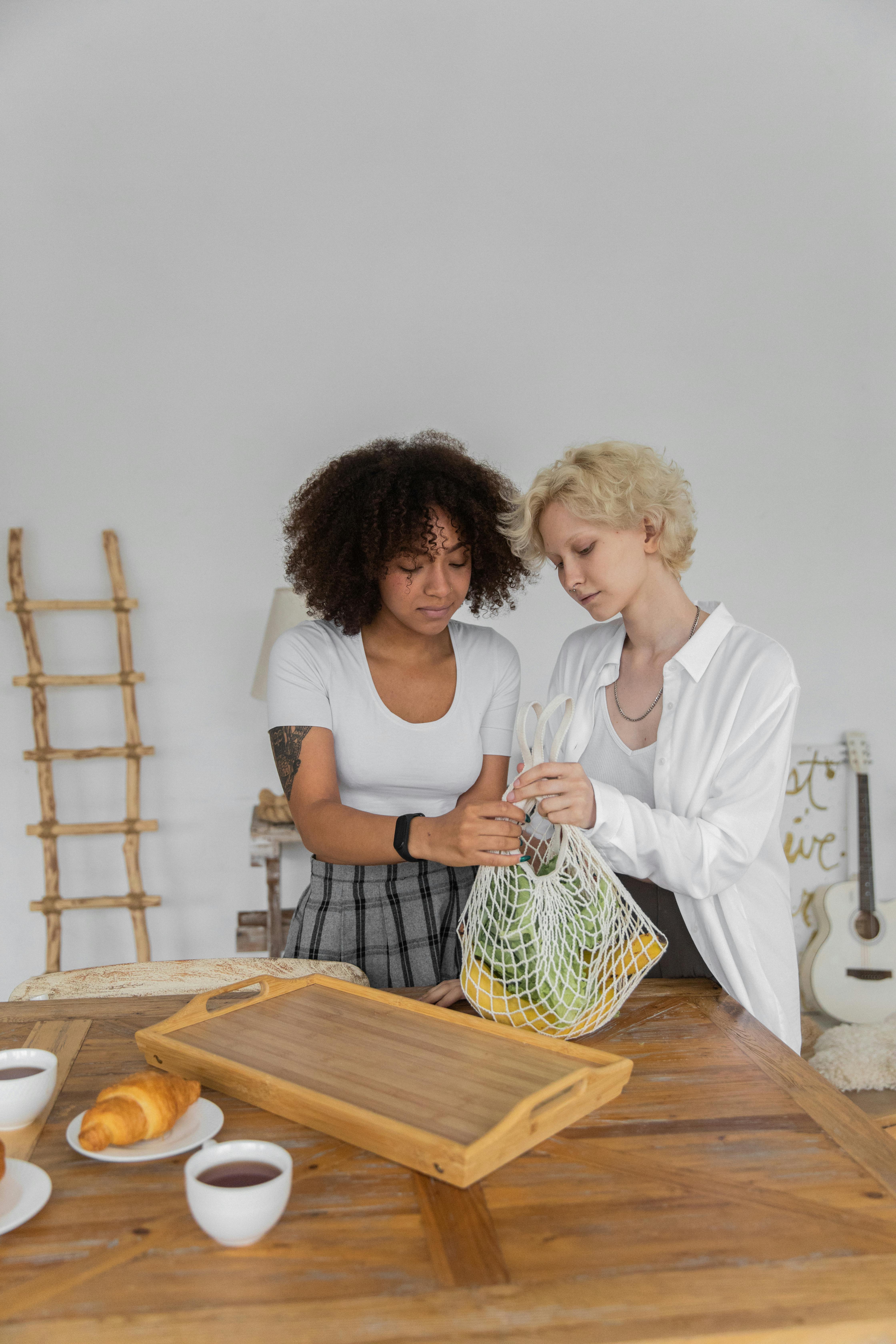 lesbian couple preparing healthy breakfast together