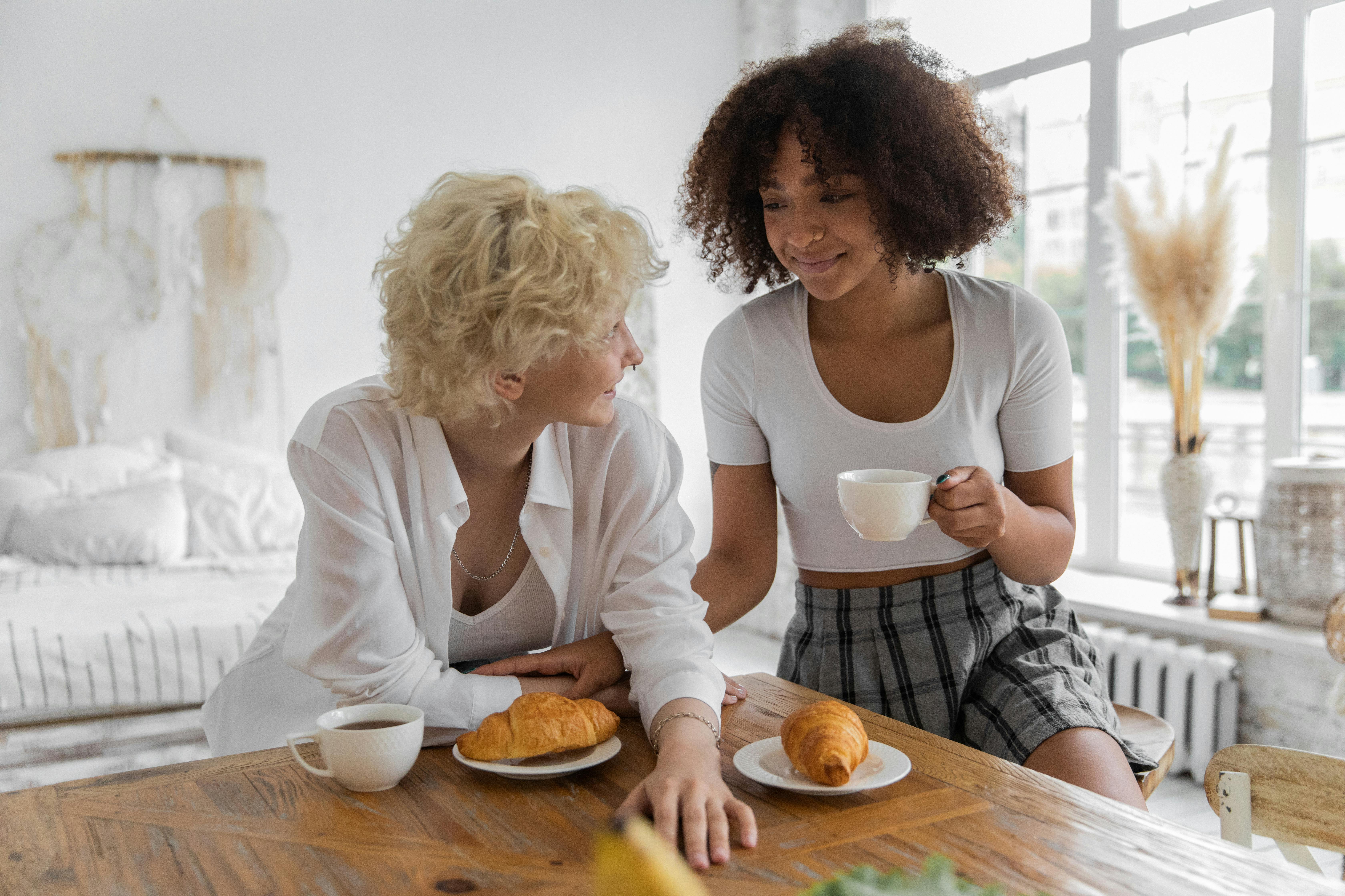 happy diverse couple having breakfast together