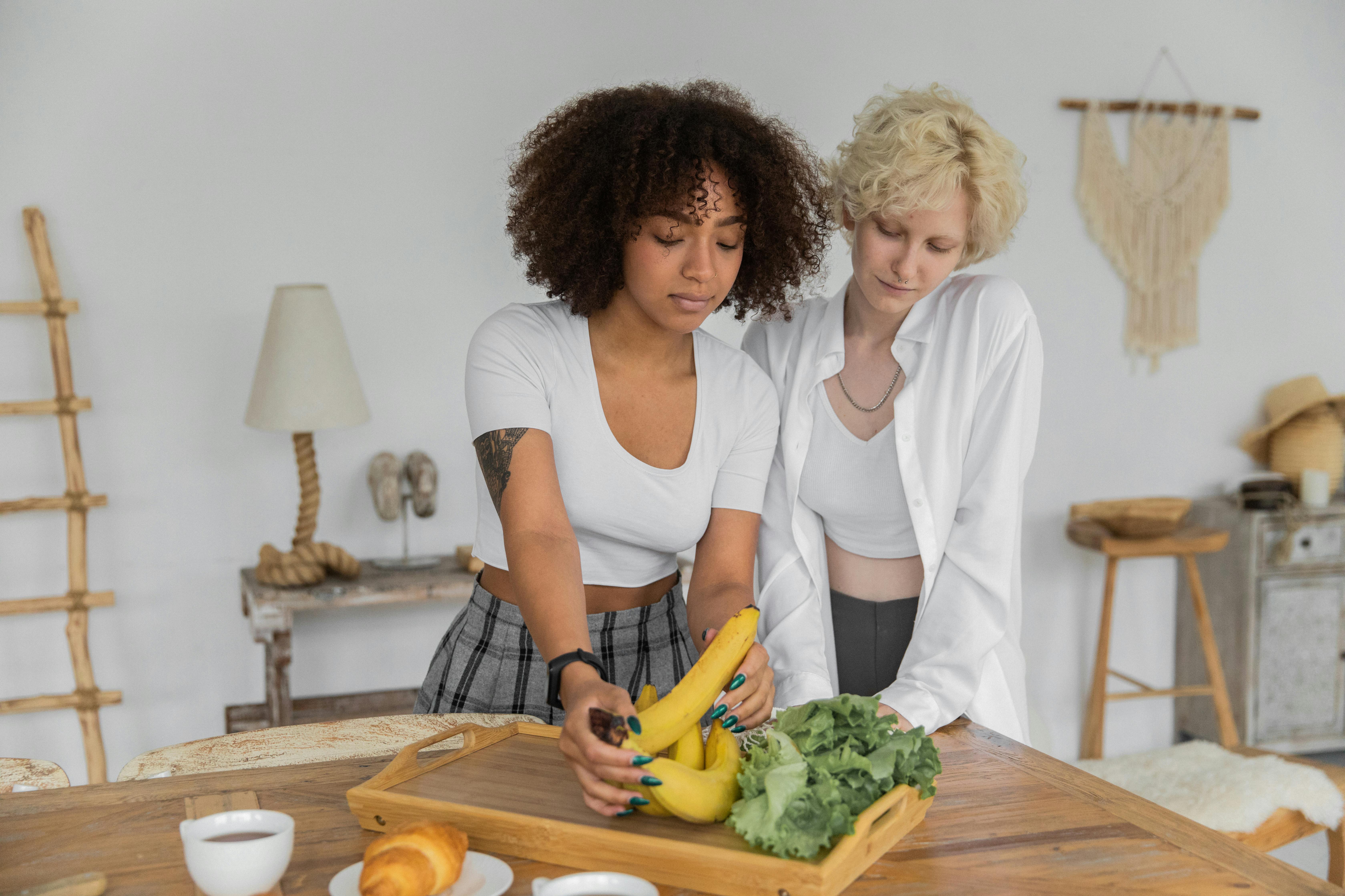 multiracial lesbian couple preparing healthy lunch