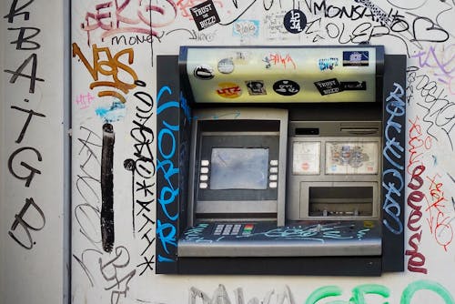 Gray Atm Machine With Graffiti