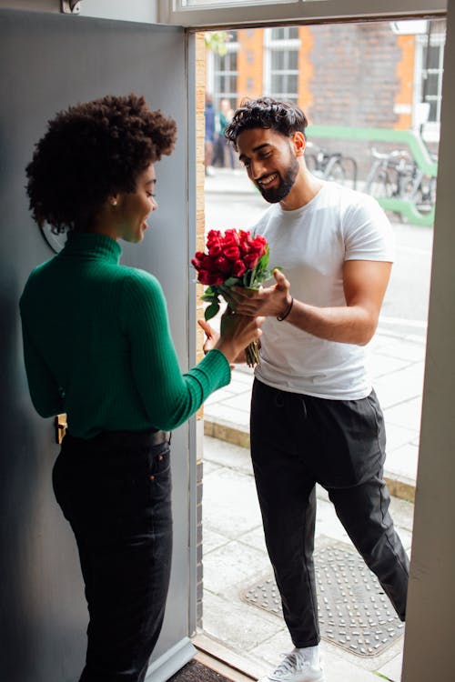 Man Giving Flowers to a Woman