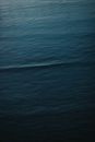 Abstract background of calm lightly rippling surface of powerful ocean in rich ultramarine color