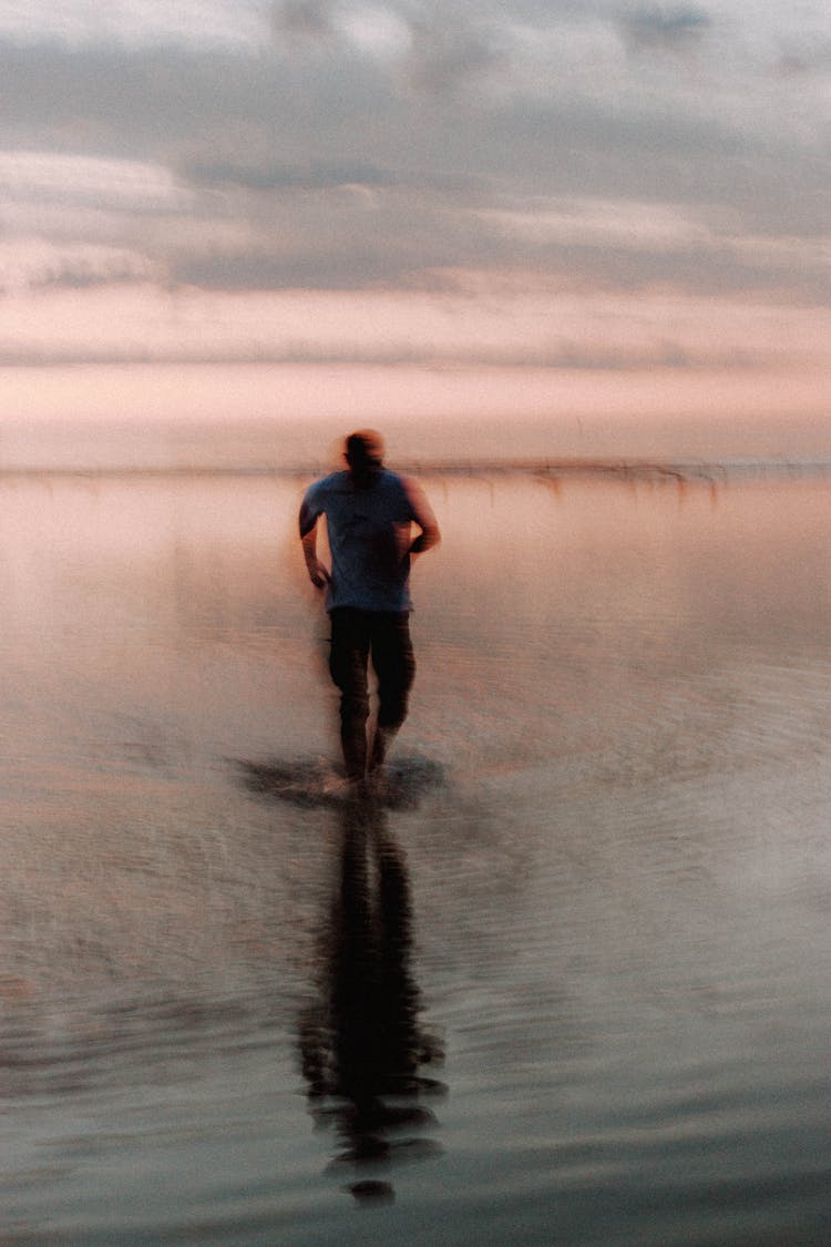 Anonymous Man Running In Water