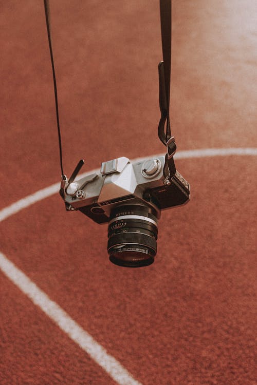 Vintage camera hanging above sports ground