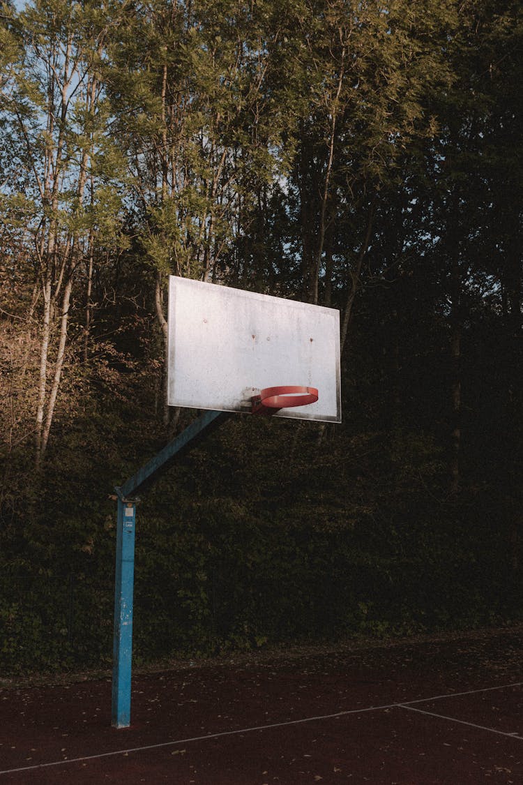 Shabby Basketball Hoop On Sports Ground