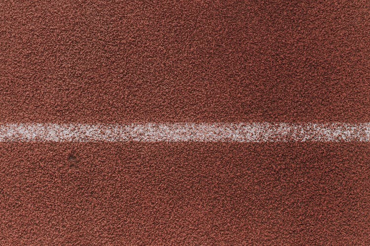 White Stripe On Red Rough Surface