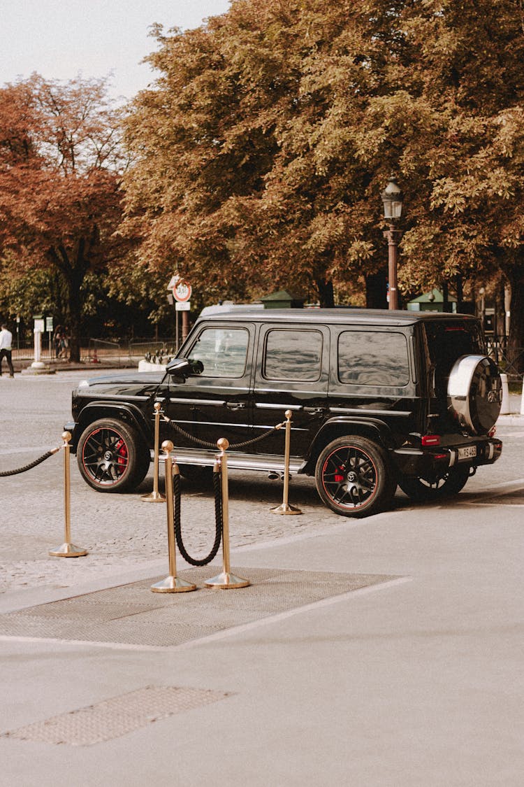 Expensive Luxury Automobile Driving On Stone Square