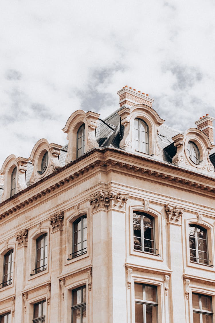 Facade Of Classic Building With Attic Floor