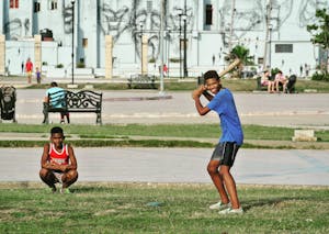 Teenagers Playing Baseball on the Park