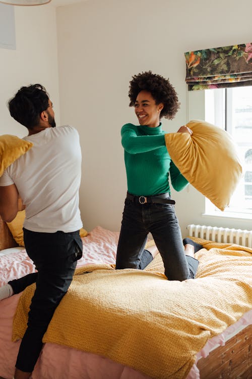 Couple Playing Pillow Fight