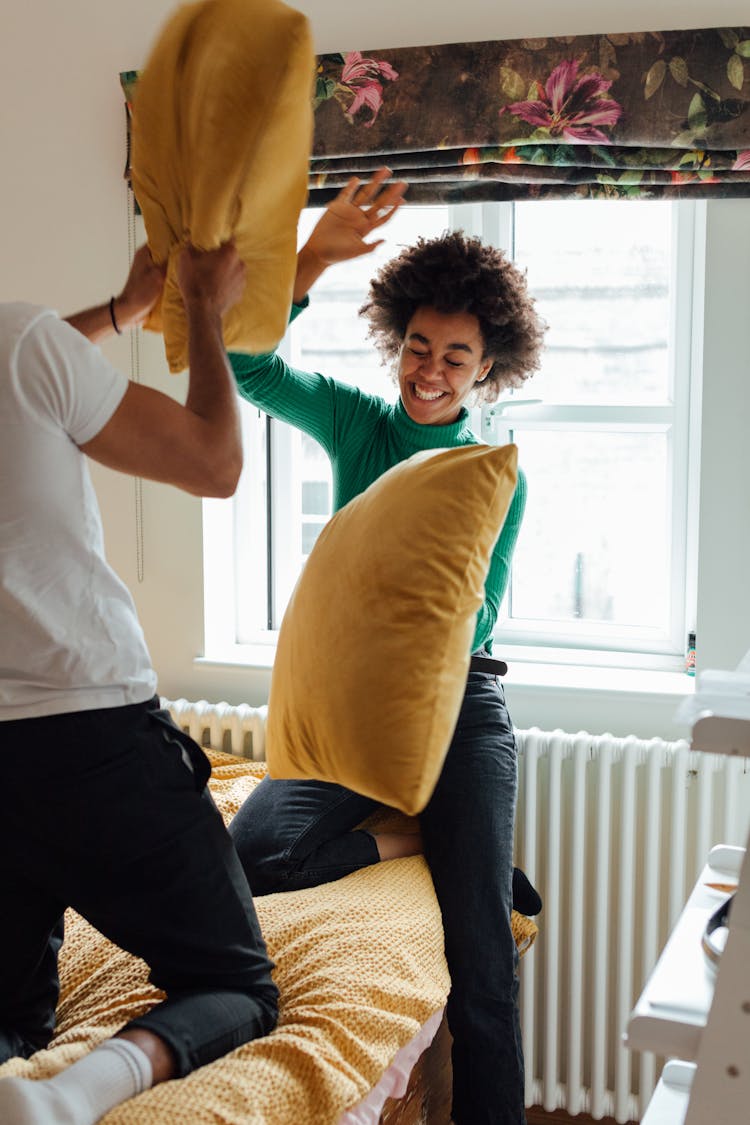 A Couple Having A Pillow Fight