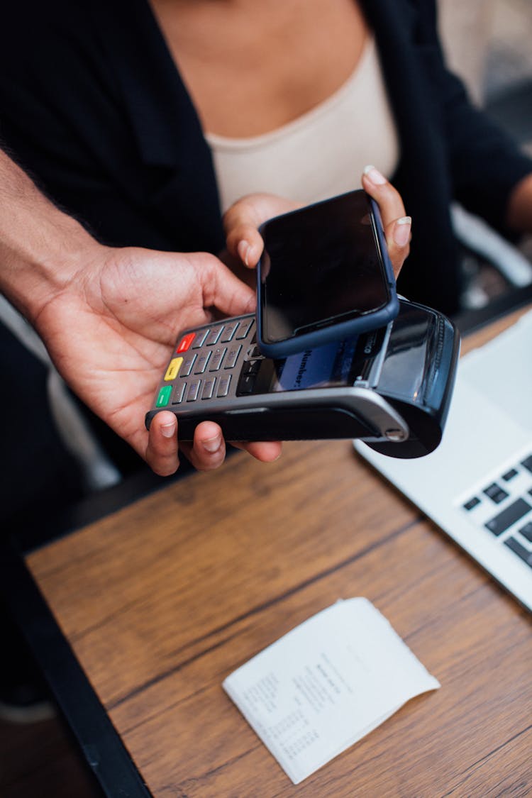 Customer Paying Contactless With A Smartphone