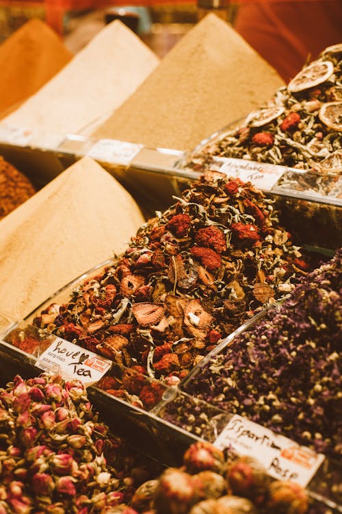 Free Containers Full of Spices and Tea Mixes on a Market Stall  Stock Photo