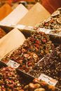 Containers Full of Spices and Tea Mixes on a Market Stall 