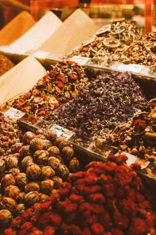 Free Colorful assortment of dried herbal teas beautifully arranged at a market stall, showcasing a variety of textures and colors. Stock Photo