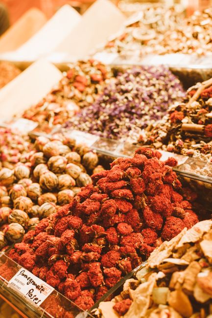 Colorful assortment of dried fruits and spices in a bustling market stall. - Key Indicators of High-Quality Dry Fruits