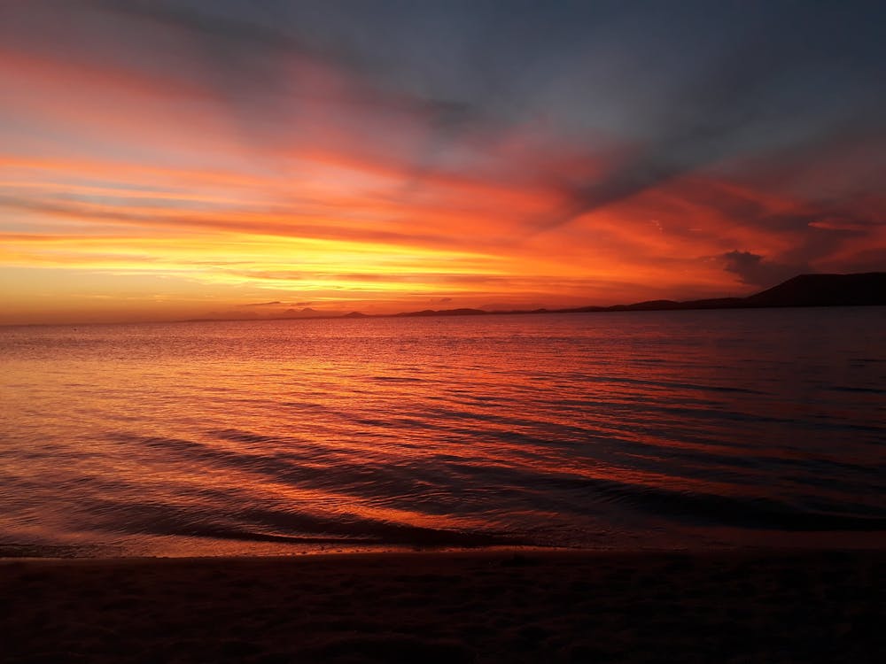 Free Body of Water during Sunset Stock Photo