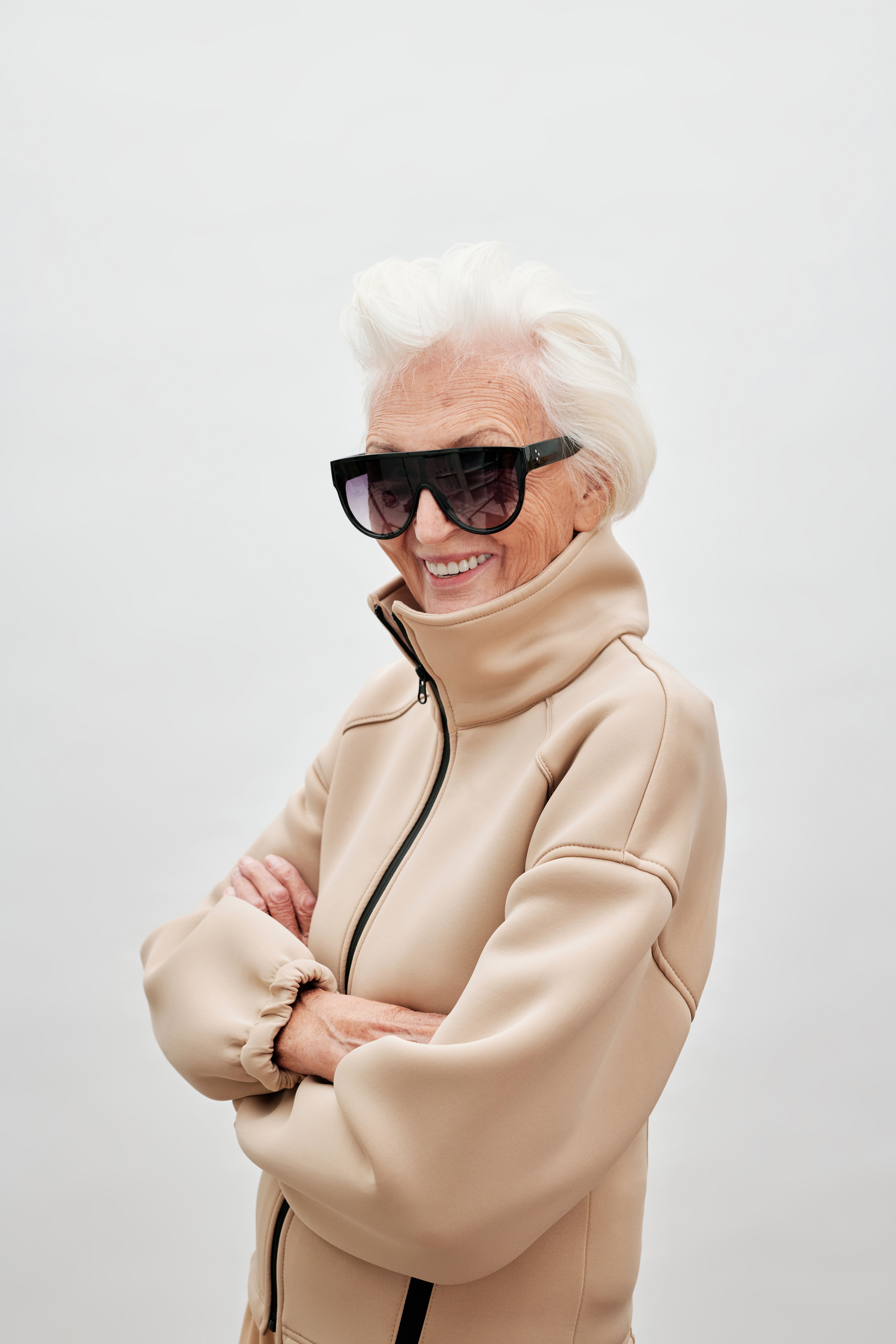 Older woman in a monochrome knit outfit