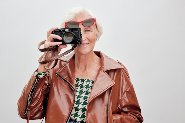 Elderly Woman Holding A Camera