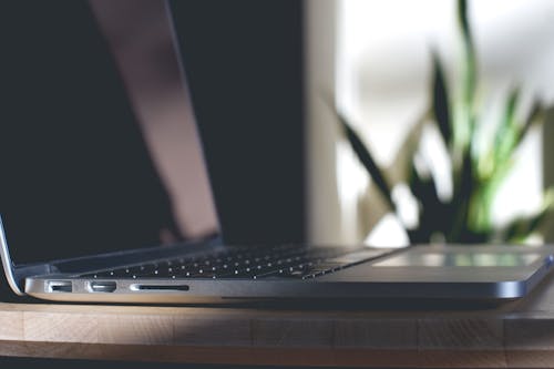 Free Turned Off Laptop Computer on Gray Wood Stock Photo