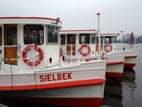 Red and White Boat on Body of Water